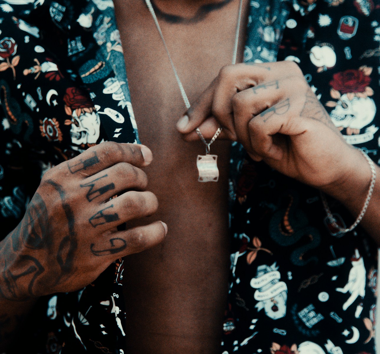 a man with tattoos on his arms and chest